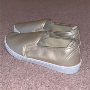 Gold slip on sneakers